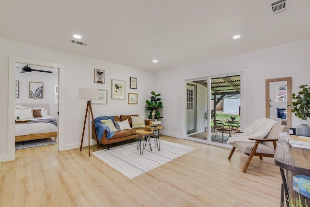sitting room with recessed lighting, light wood-style flooring, and visible vents