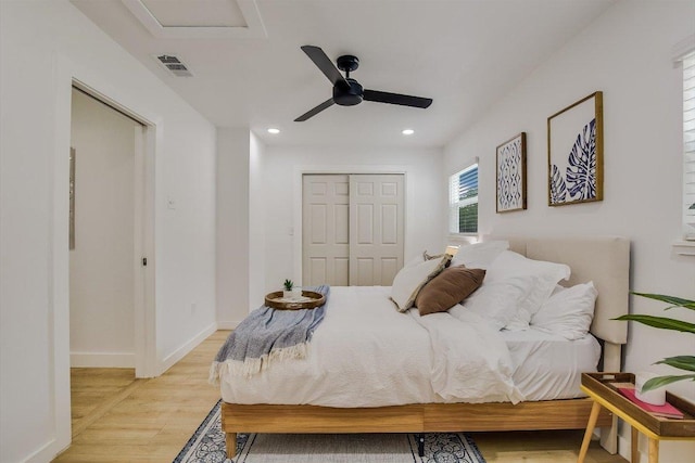 502 Tilbury Ln, Austin, TX 78745 - bedroom featuring light wood-style flooring, recessed lighting, a ceiling fan, attic access, and a closet
