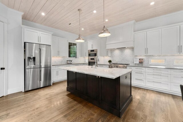 kitchen featuring wood ceiling, stainless steel appliances, recessed lighting, and white cabinetry