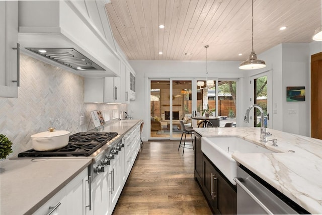kitchen with wood ceiling, decorative light fixtures, dishwasher, a sink, and recessed lighting