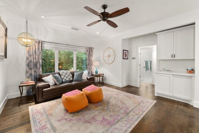 living room with visible vents, recessed lighting, baseboards, and ceiling fan with notable chandelier