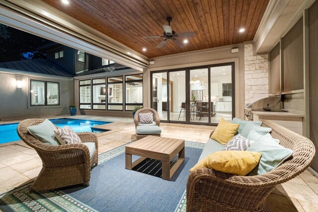 view of patio with ceiling fan, outdoor lounge area, and an outdoor pool