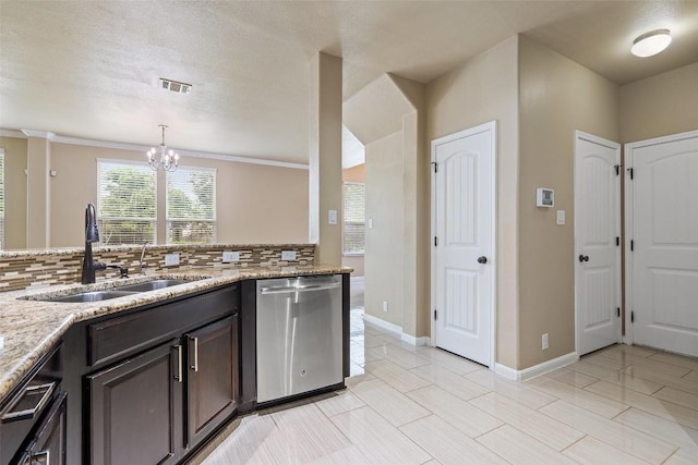 kitchen featuring a sink, decorative backsplash, dishwasher, and a notable chandelier