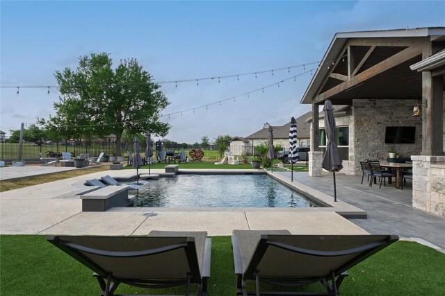 view of pool featuring a fenced in pool and a patio area