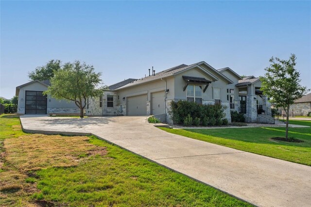 single story home featuring an attached garage, a front lawn, stucco siding, and concrete driveway