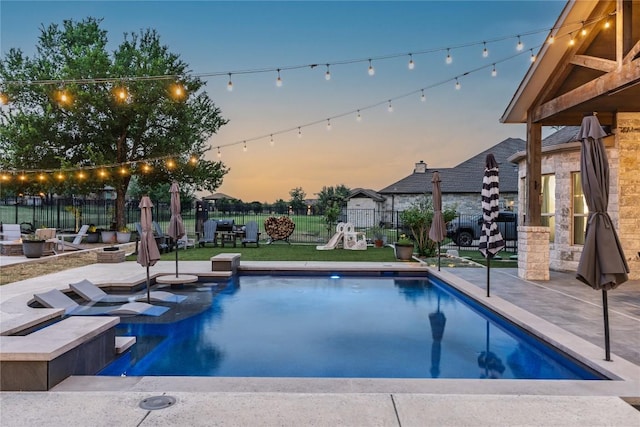 409 Flintlock Dr, Leander, TX 78641 - view of swimming pool featuring a patio area and an outdoor fire pit