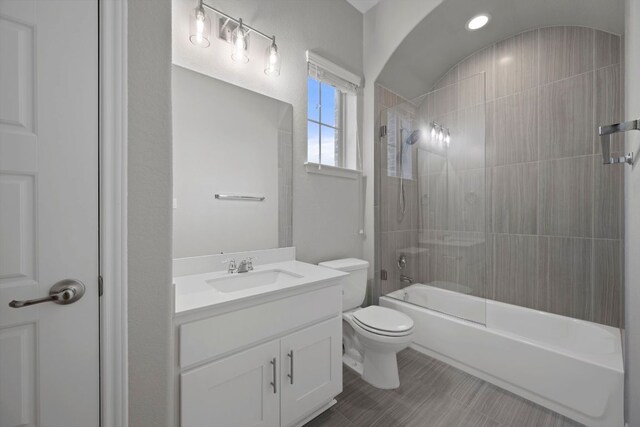 full bathroom featuring vanity, shower / bathing tub combination, and toilet