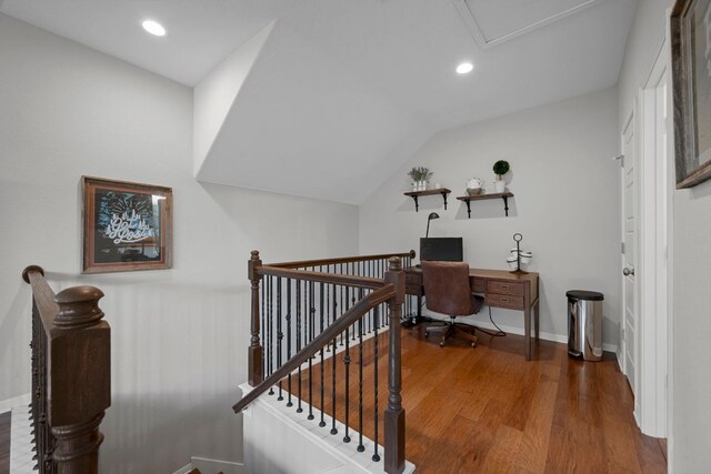office space with baseboards, recessed lighting, wood finished floors, and lofted ceiling