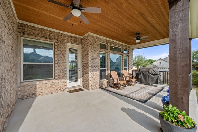 view of patio featuring area for grilling and a ceiling fan