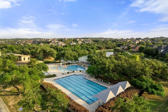 drone / aerial view with a residential view and a water view