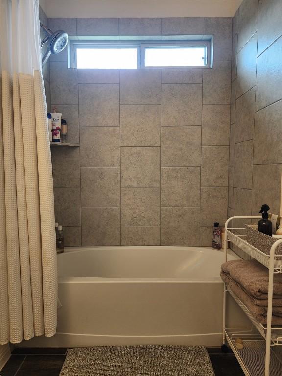 full bathroom featuring shower / tub combo with curtain