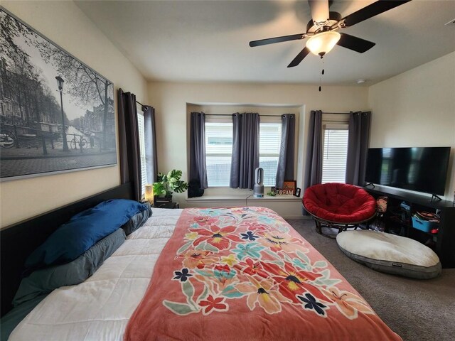 bedroom with ceiling fan and carpet flooring