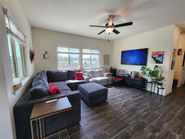 living room with wood tiled floor and ceiling fan