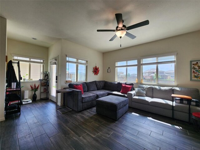 living room featuring a ceiling fan and wood tiled floor