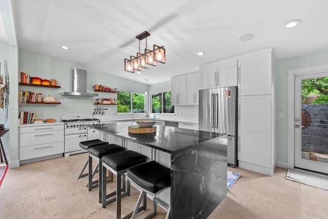 kitchen featuring recessed lighting, open shelves, wall chimney exhaust hood, and stainless steel appliances
