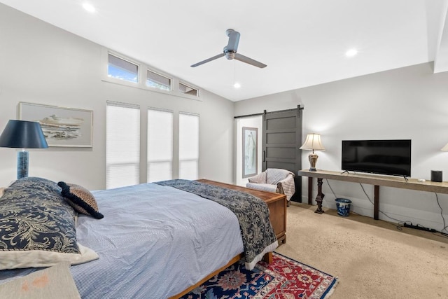 1705 Westmoor Dr, Austin, TX 78723 - carpeted bedroom featuring a barn door, vaulted ceiling, a ceiling fan, and recessed lighting