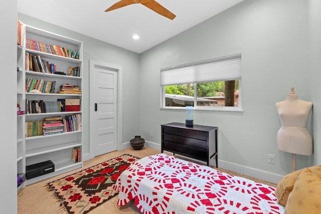carpeted bedroom with baseboards, a ceiling fan, and lofted ceiling