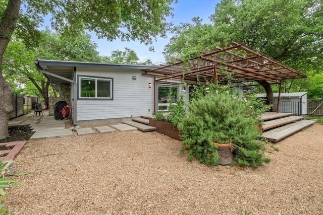 1705 Westmoor Dr, Austin, TX 78723 - rear view of property with a pergola and a deck