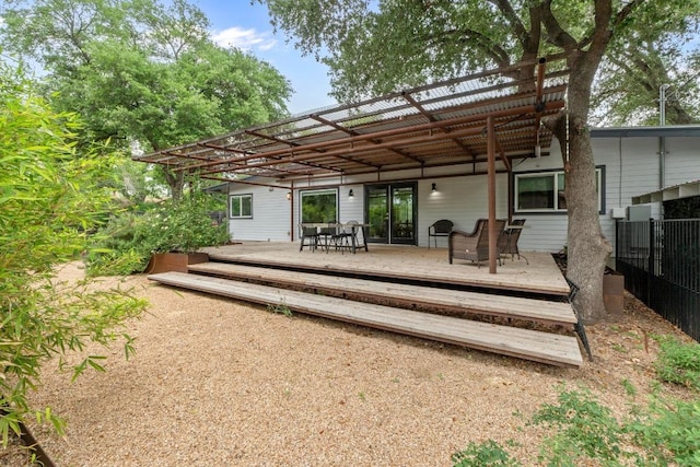 1705 Westmoor Dr, Austin, TX 78723 - rear view of property with a deck and outdoor dining space