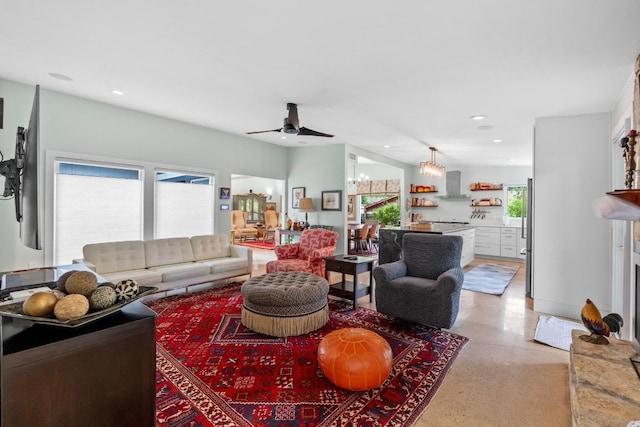 living area featuring recessed lighting, ceiling fan, and light speckled floor