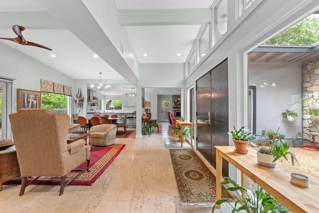 interior space featuring visible vents, recessed lighting, speckled floor, and ceiling fan with notable chandelier