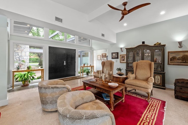 living area featuring a ceiling fan, high vaulted ceiling, visible vents, and speckled floor