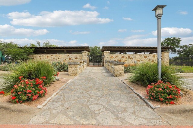 exterior space with fence and a gate