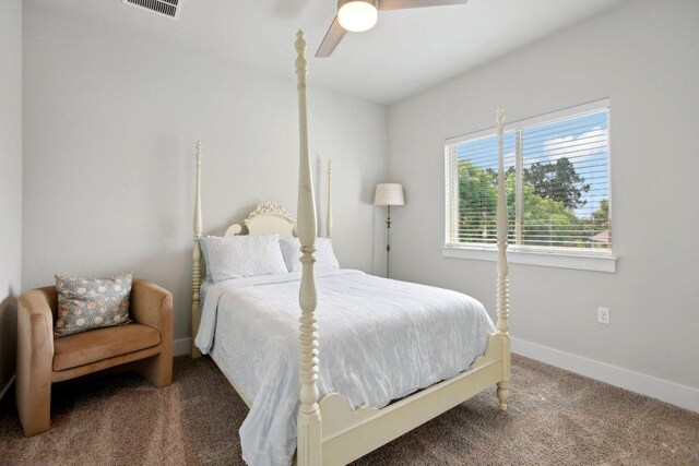 bedroom featuring carpet flooring, baseboards, visible vents, and ceiling fan