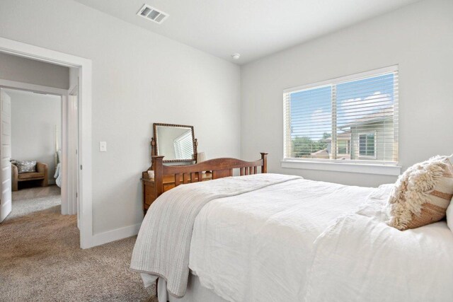 bedroom with visible vents, baseboards, and carpet floors