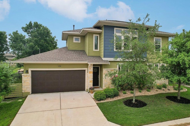 1708 Loyal Friend Dr Unit 46, Leander, TX 78641 - view of front of home with stone siding, concrete driveway, a shingled roof, an attached garage, and a front yard