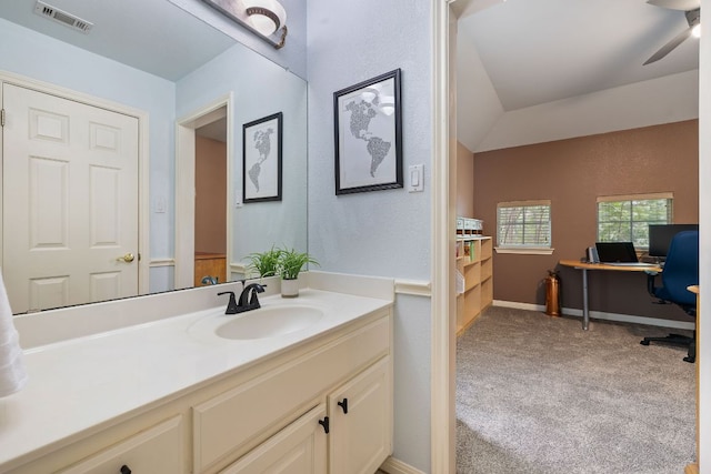 bathroom with visible vents, baseboards, ceiling fan, and vanity