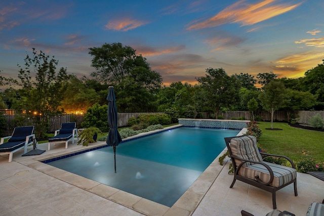 view of pool with a patio, a fenced backyard, a yard, and a fenced in pool