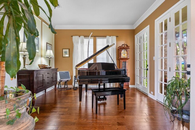 sitting room with crown molding, baseboards, and hardwood / wood-style floors