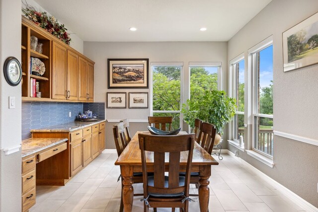 dining space featuring plenty of natural light, recessed lighting, and light tile patterned floors