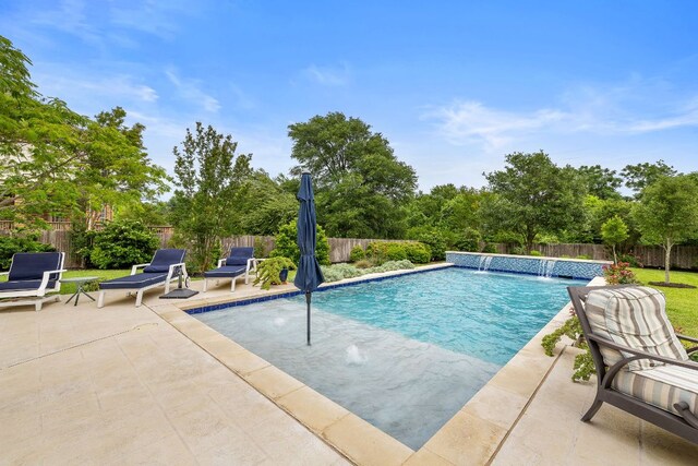 view of swimming pool with a patio, a fenced in pool, and a fenced backyard