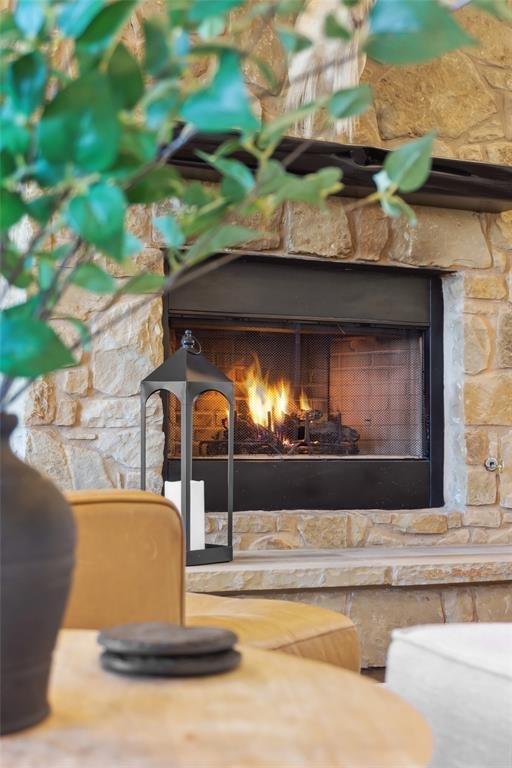 details with a stone fireplace