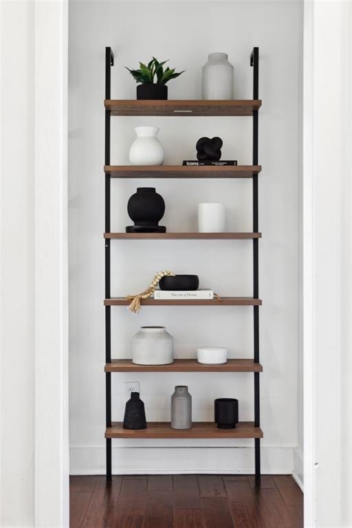 interior details featuring baseboards and wood finished floors