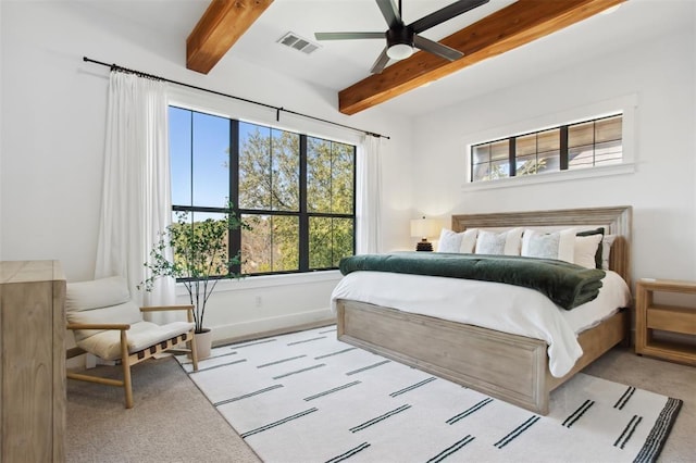 bedroom featuring ceiling fan, beam ceiling, carpet, baseboards, and visible vents