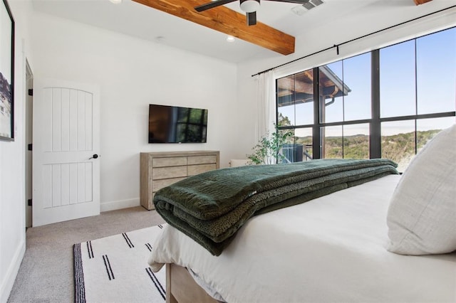 bedroom featuring ceiling fan, carpet, baseboards, beamed ceiling, and visible vents