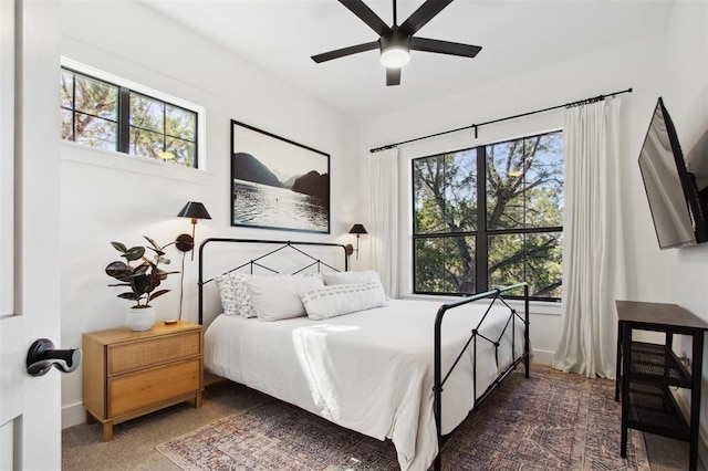 bedroom with baseboards and ceiling fan