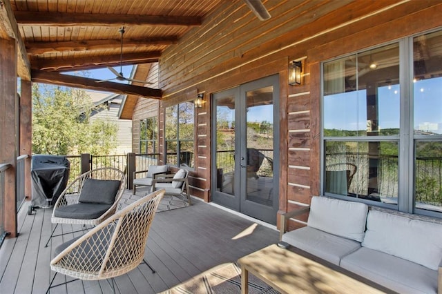wooden deck with grilling area and french doors
