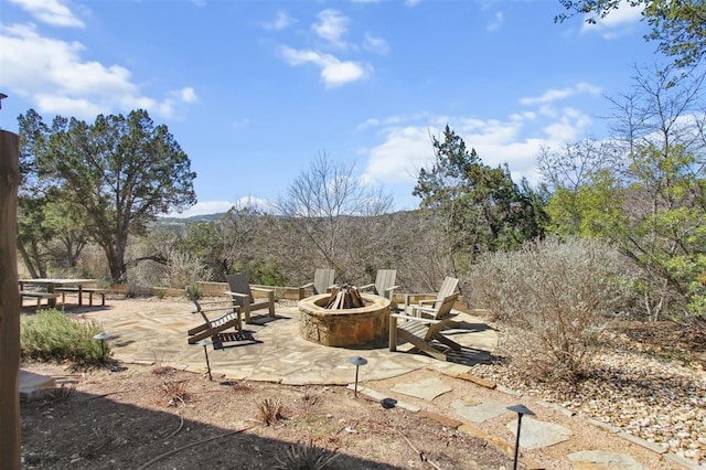 view of patio / terrace with a fire pit