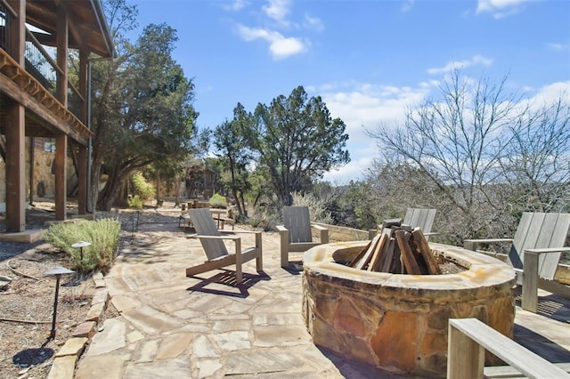 view of patio with a fire pit