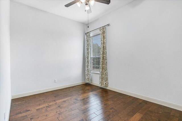 unfurnished room featuring baseboards, ceiling fan, and hardwood / wood-style floors