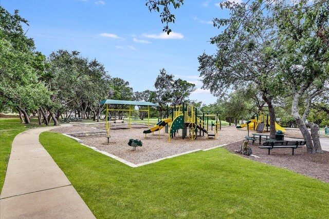 community playground featuring a lawn