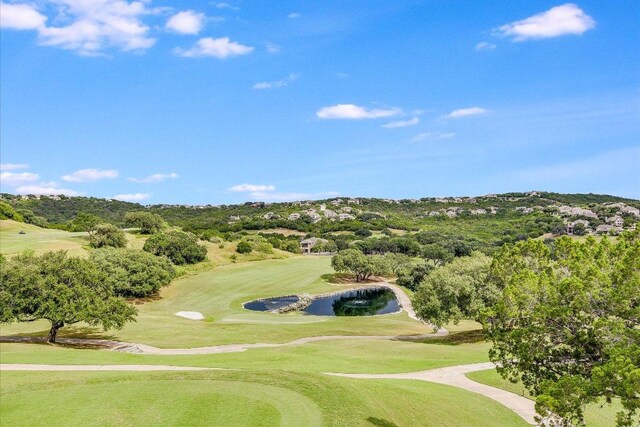 view of property's community featuring a water view and golf course view