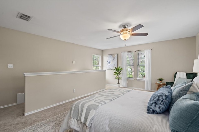 406 W 55th 1/2 St, Austin, TX 78751 - bedroom with baseboards, light colored carpet, and a ceiling fan