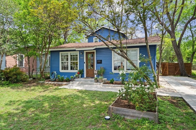 406 W 55th 1/2 St, Austin, TX 78751 - view of front of house with a vegetable garden