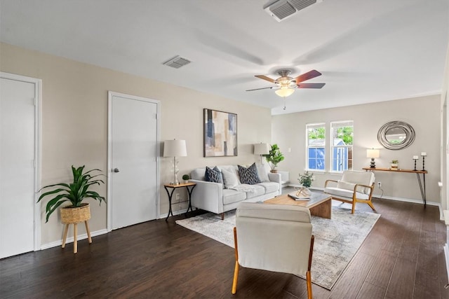 406 W 55th 1/2 St, Austin, TX 78751 - living area featuring a ceiling fan, dark wood-style flooring, and baseboards