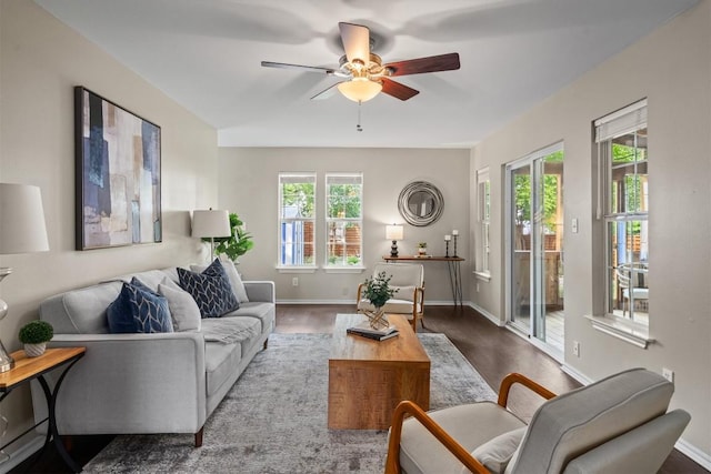 406 W 55th 1/2 St, Austin, TX 78751 - living area featuring healthy amount of natural light, a ceiling fan, wood finished floors, and baseboards